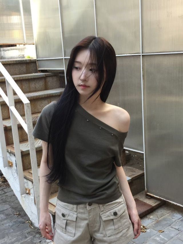 Asymmetric Star-Stud Top